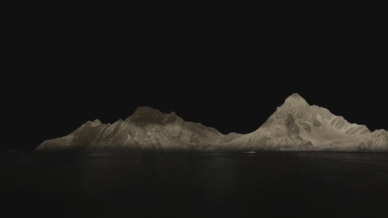 Dark water and mountains at dusk